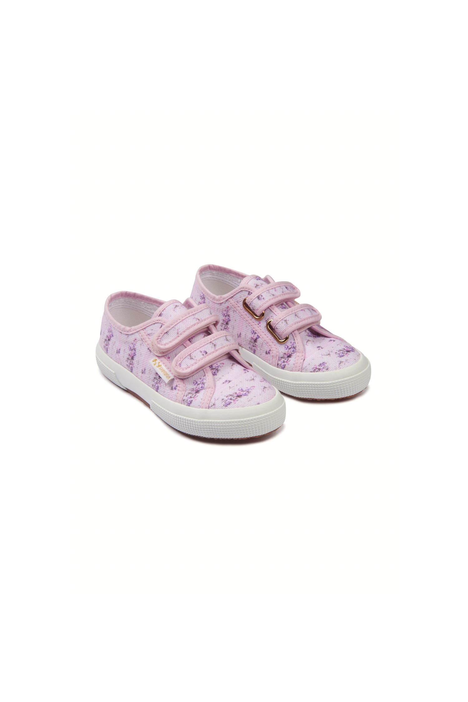 Pink sneakers with florals on printed cotton, and gold-tone eyelet details and velcro straps. 