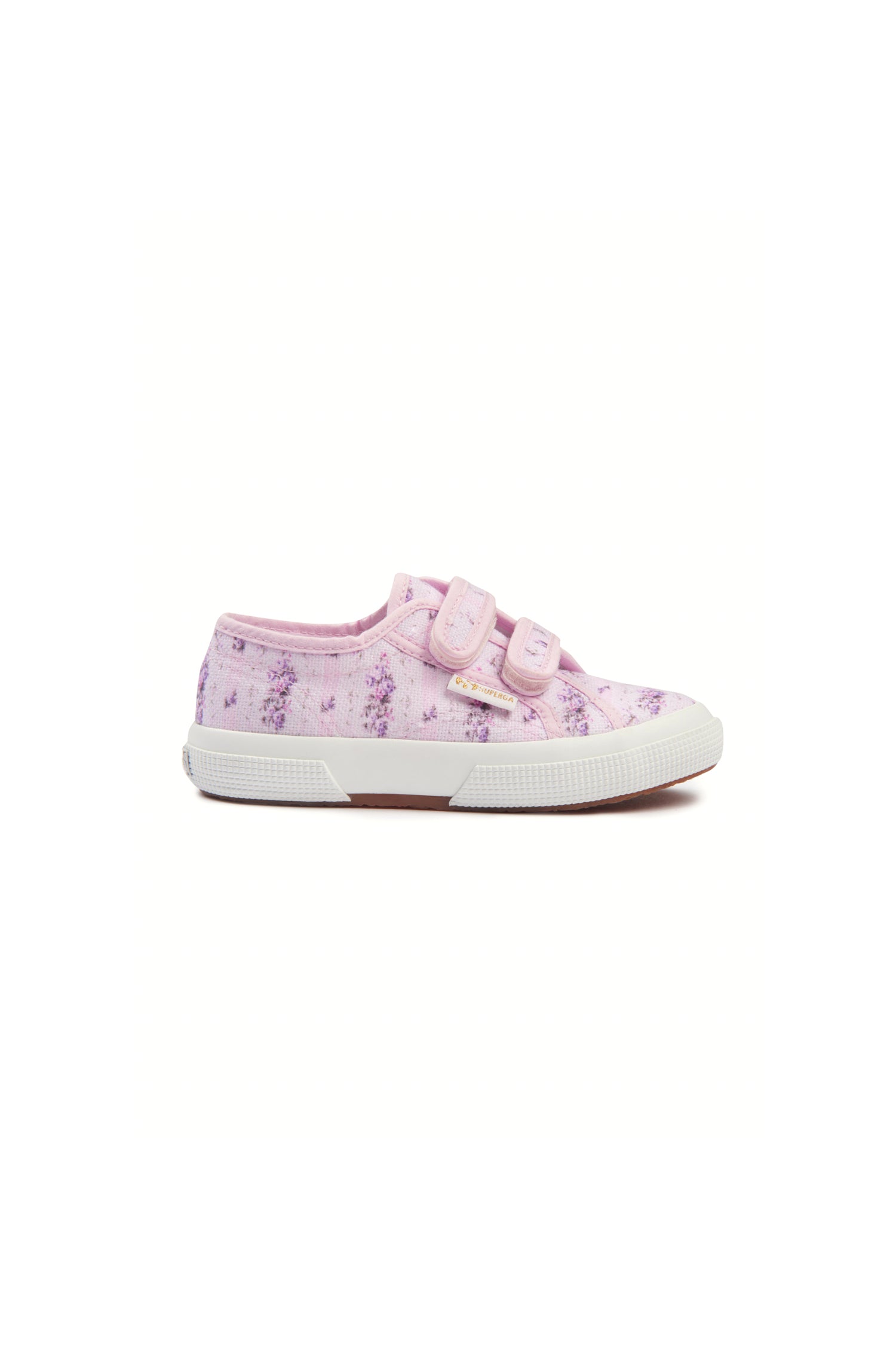 Pink sneakers with florals on printed cotton, and gold-tone eyelet details and velcro straps. 