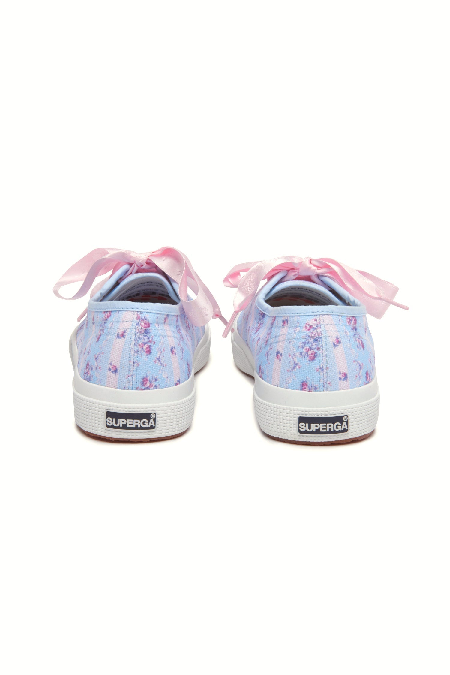 Pastel blue sneaker with floral pattern on printed cotton, gold-toned eyelet details, and pink velvet laces.