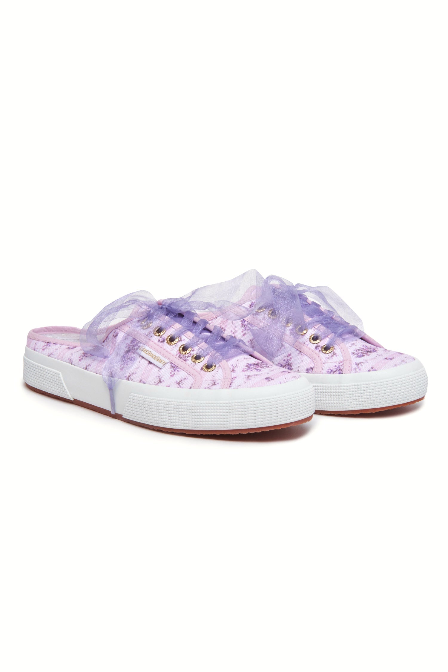 Purple mule sneakers with florals on printed cotton with purple tulle laces, and gold-tone eyelet details.