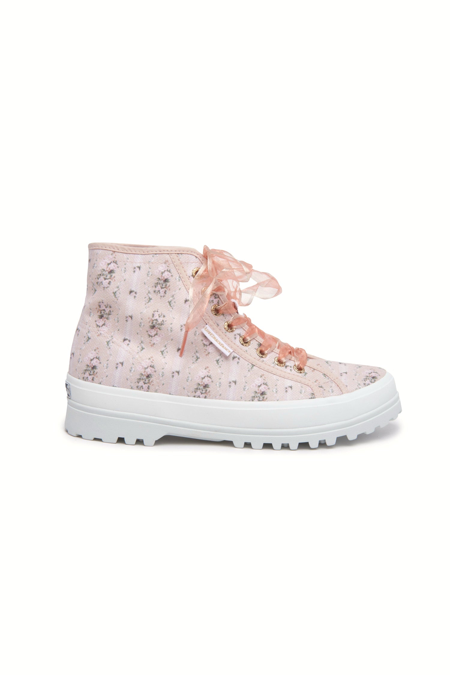 Pink hightop sneakers with florals on printed cotton with pink tulle laces, and gold-tone eyelet details.