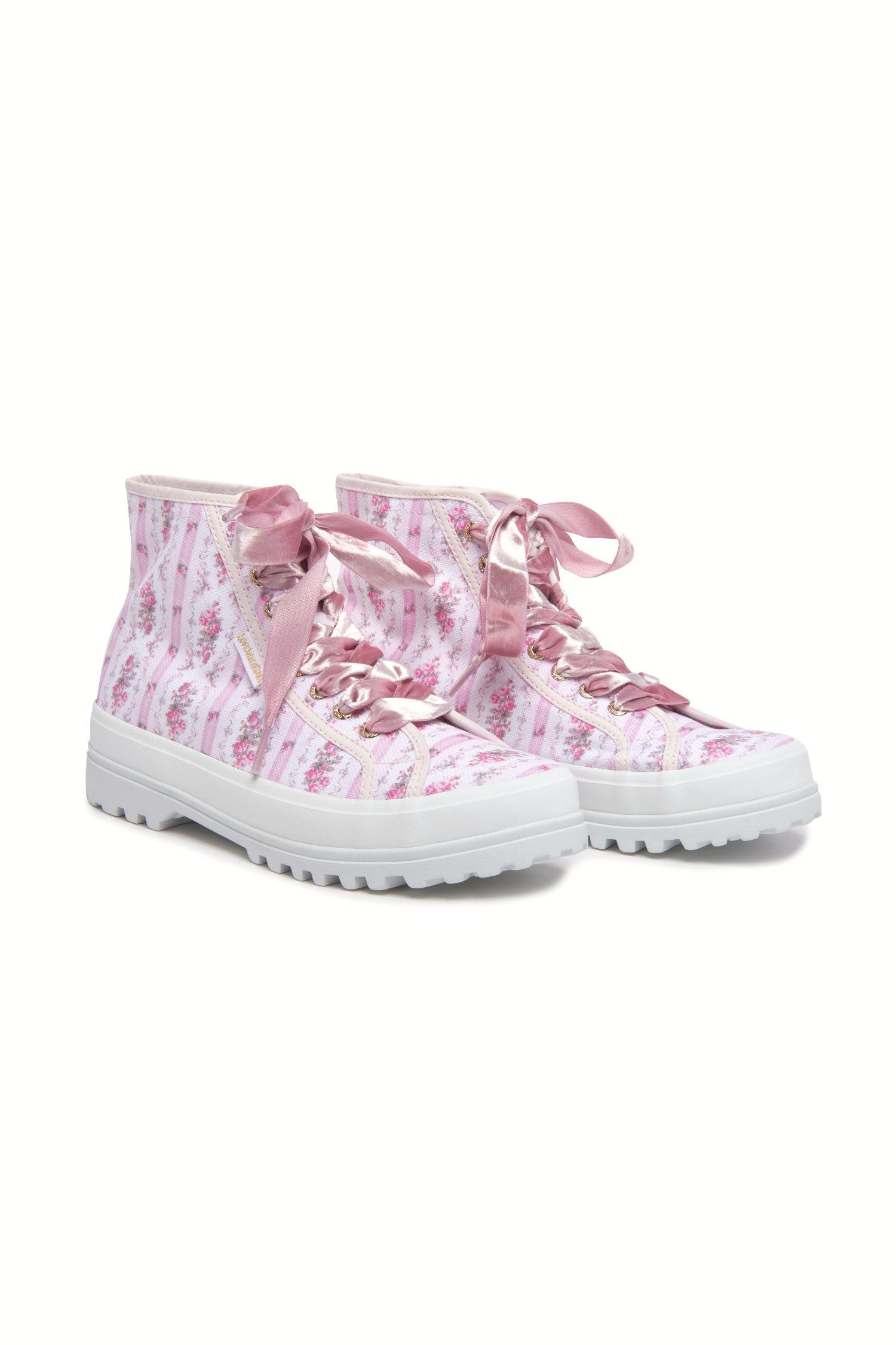 Pink hightop sneakers with florals on printed cotton with pink velvet laces, and gold-tone eyelet details.